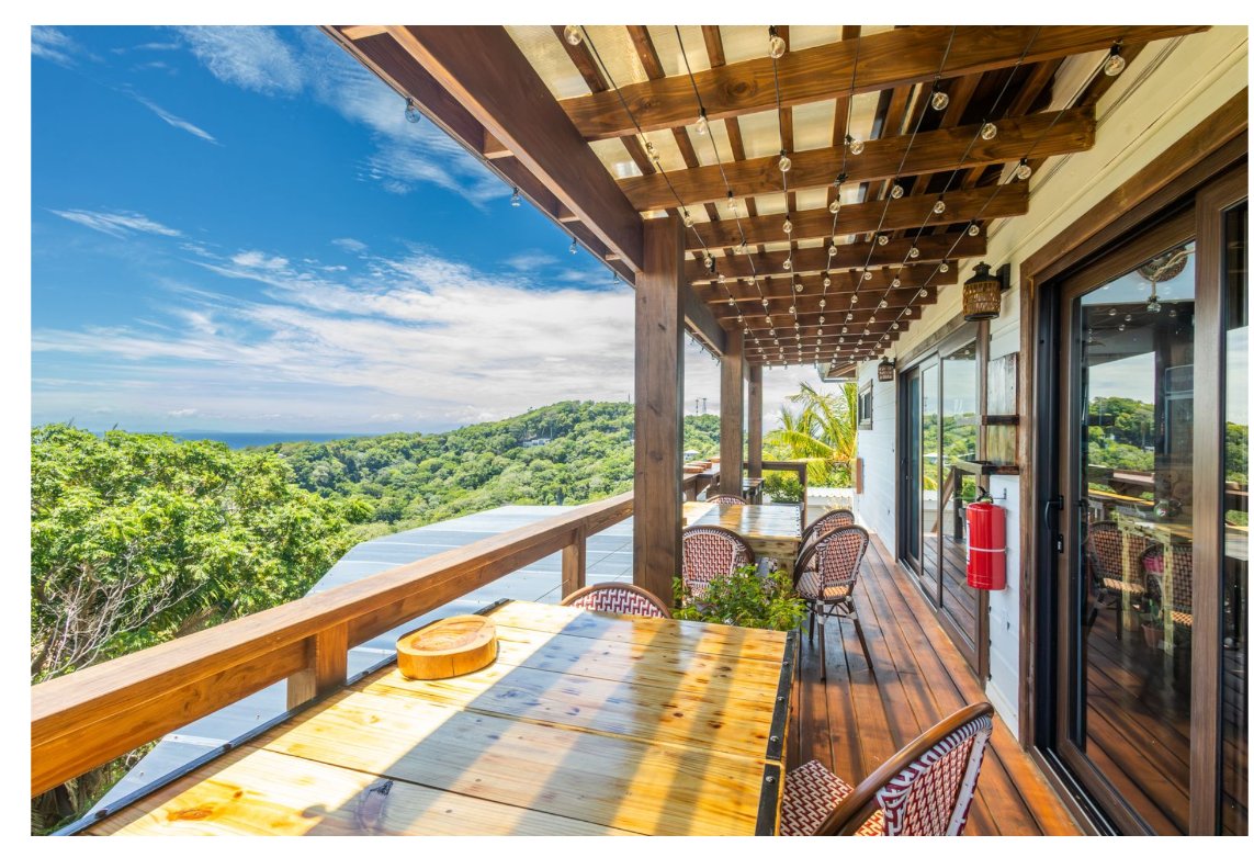 Covered terrace restaurant space with ocean view at Windward Terraces
