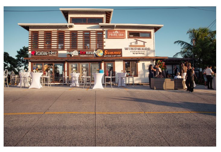Windward Terraces flagship property — daytime street-front exterior in West Bay, Roatán